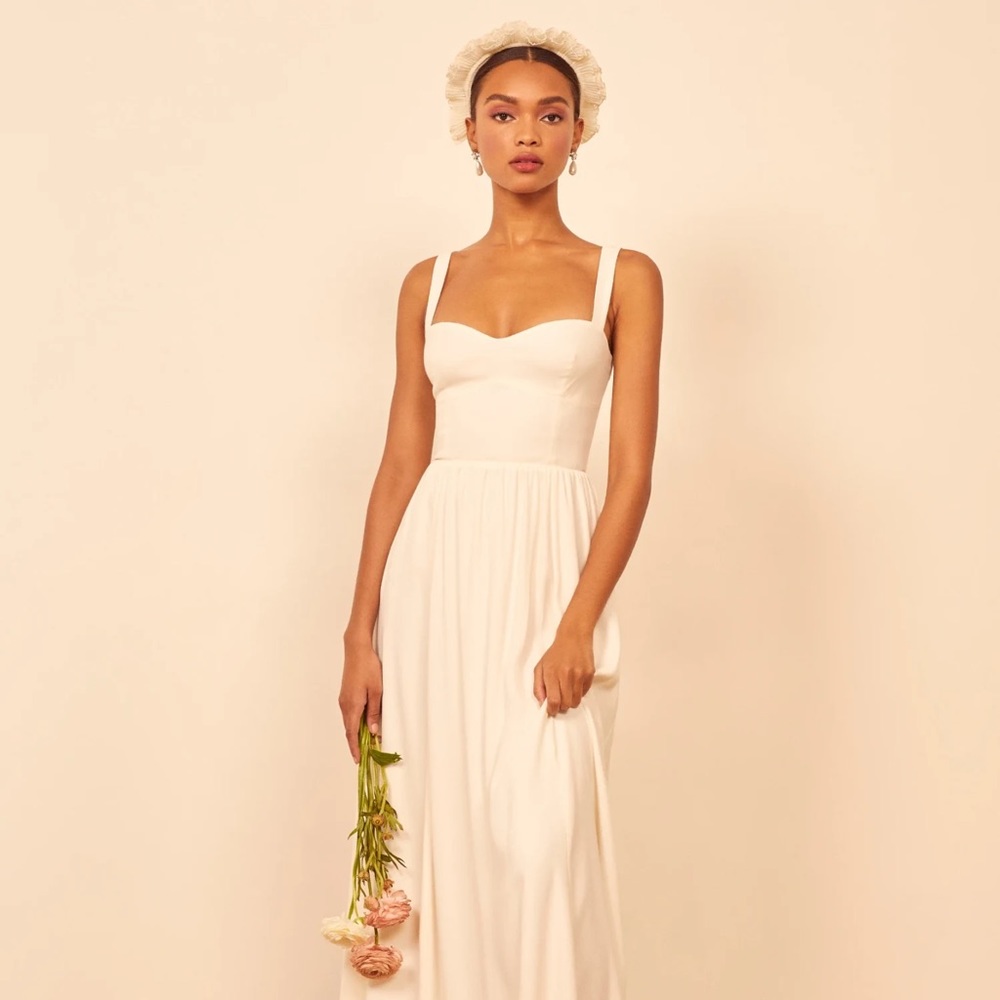 New with tags Hollyhock dress by Reformation. Color is ivory, size 6.